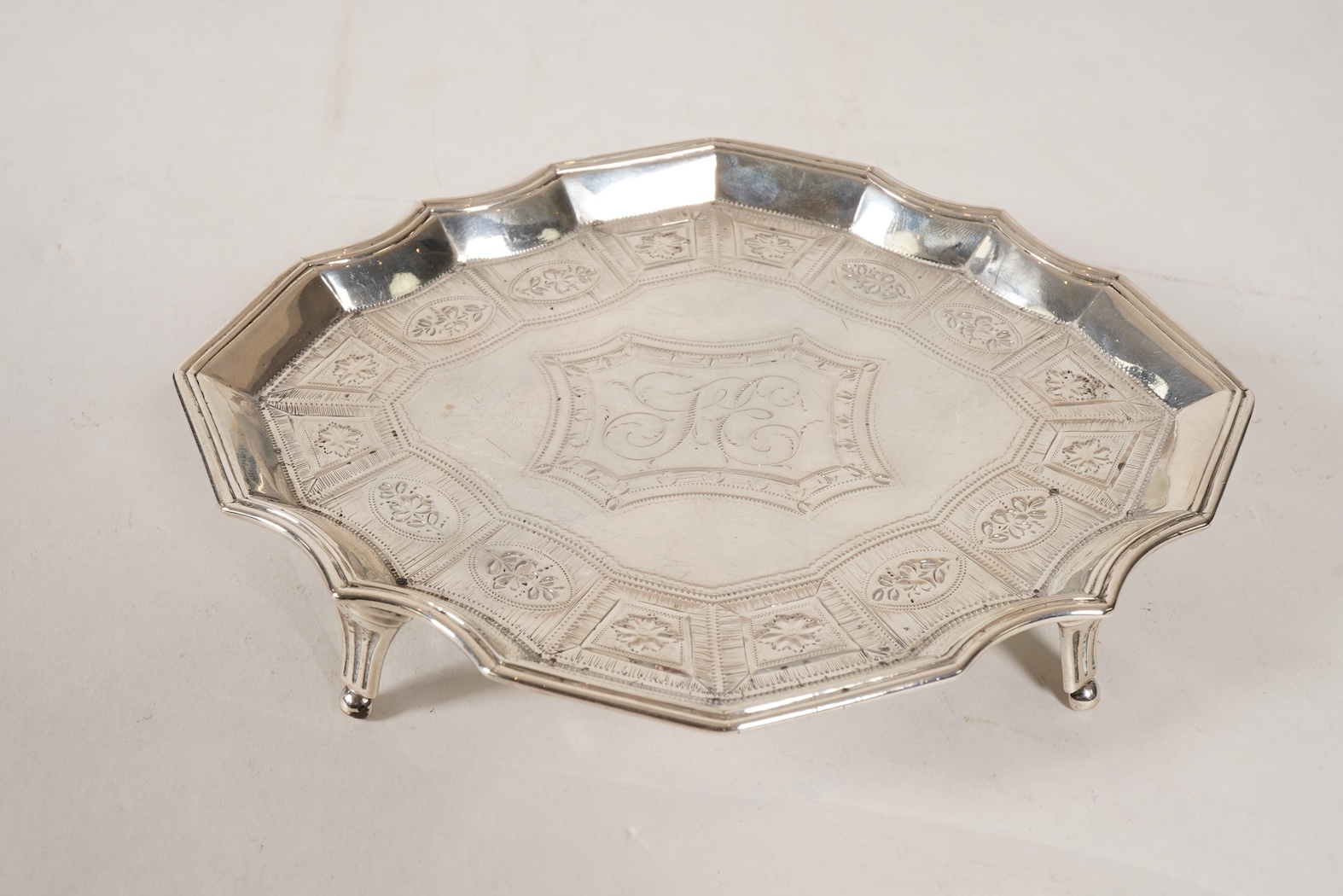 A George III bright cut engraved silver teapot and matching stand by Robert Hennell I